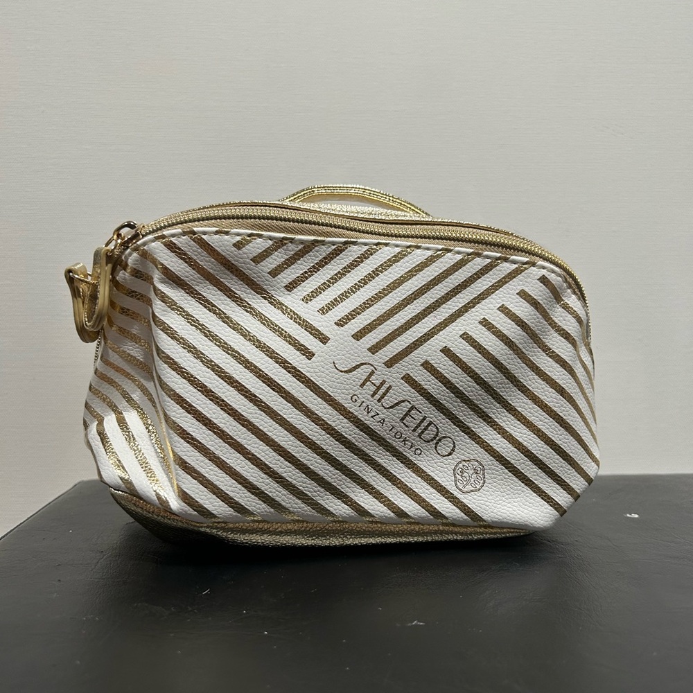 Shiseido Ginza Tokyo Gold and White Diagonal Striped Cosmetic Bag